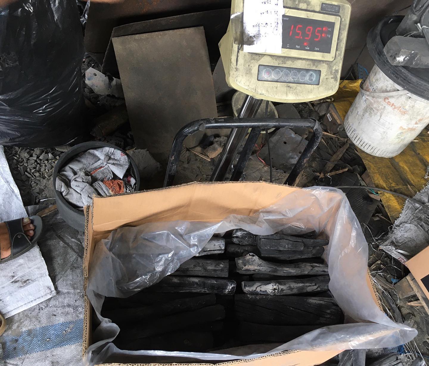 Hardwood charcoal logs stacked, ready for wholesale packaging