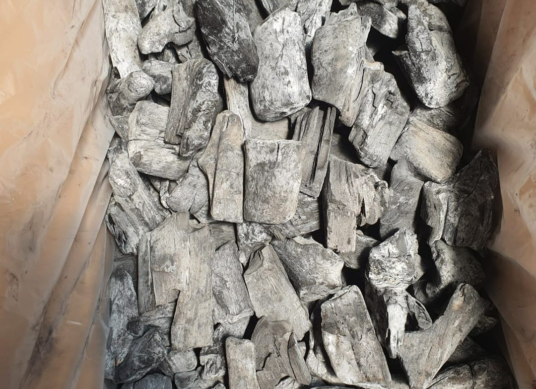 Mangrove lump charcoal pieces close-up in a bag