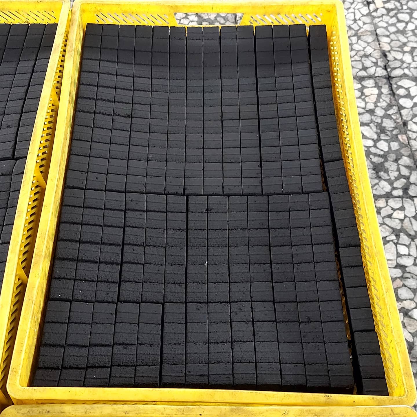 Fruitwood charcoal cut into short pieces, packed in a crate