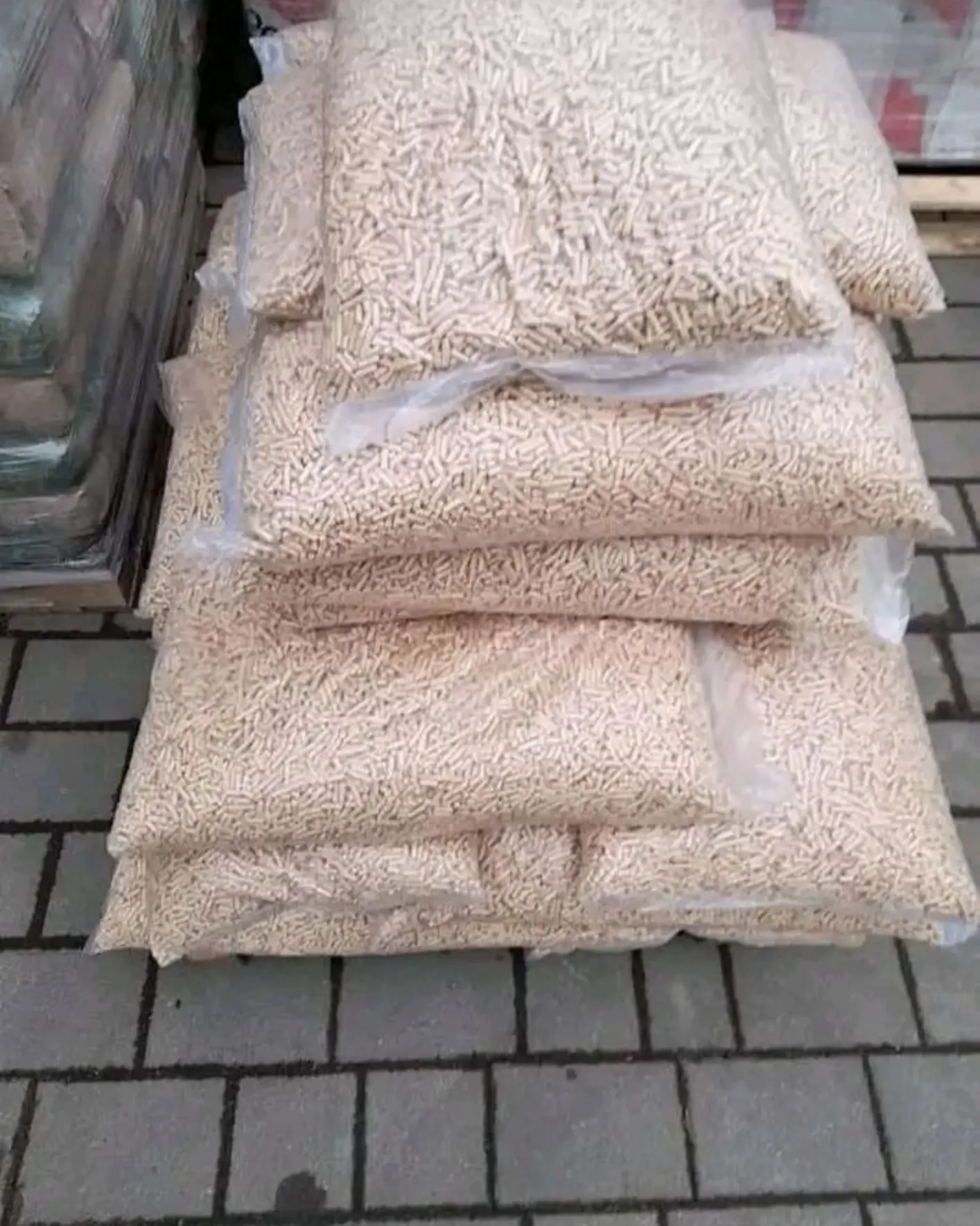 Silver fir wood pellet bags stacked and tied for wholesale delivery