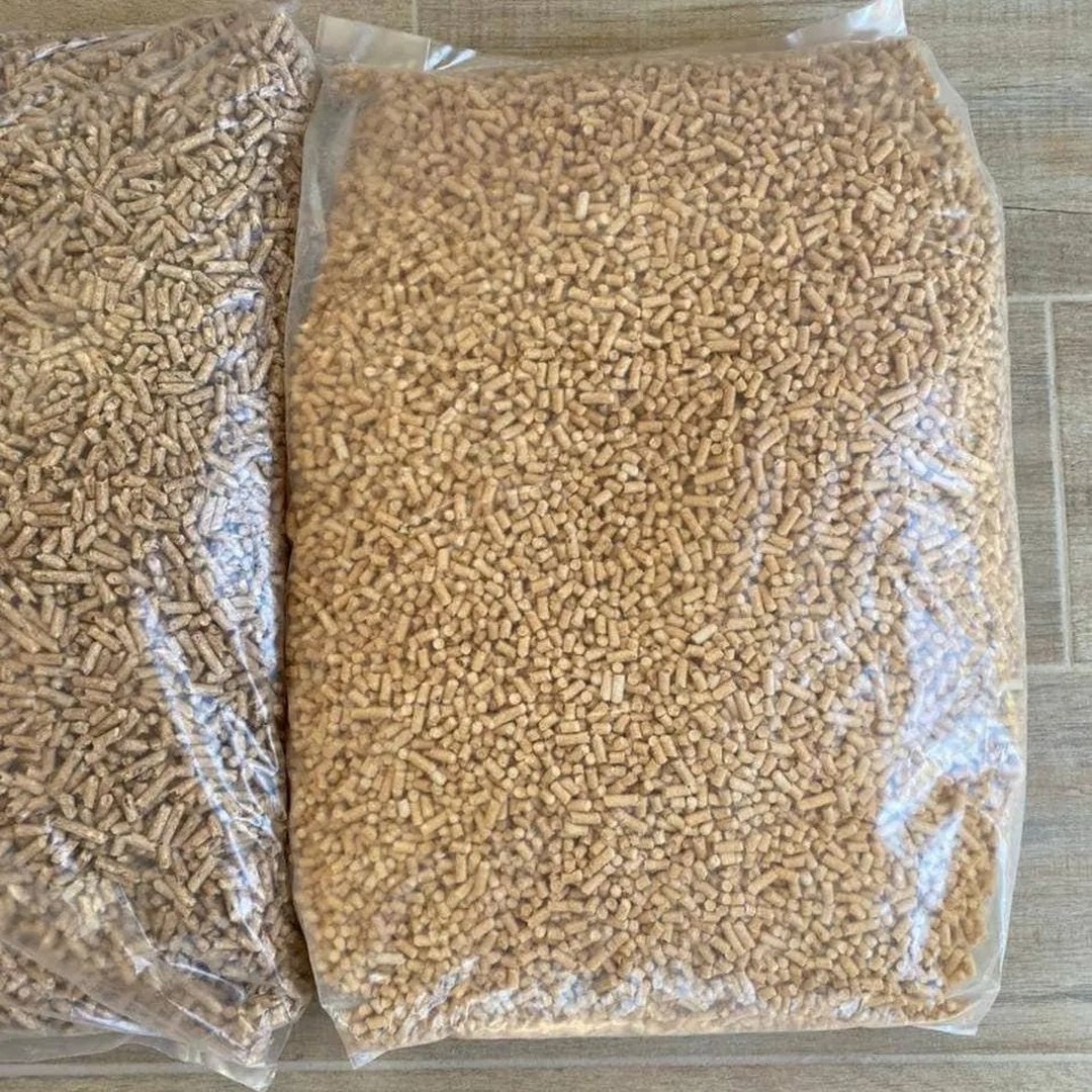 Spruce wood pellet bags stacked on a pallet