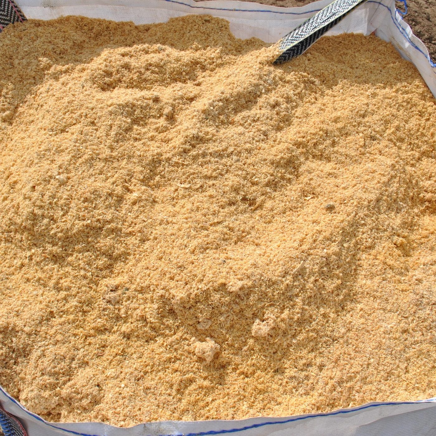 Fine wood dust in big bag, industrial supply for particleboard production